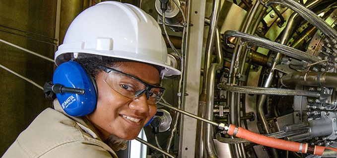 Field Service worker analyzing machinery