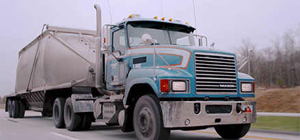 Blue truck driving on highway