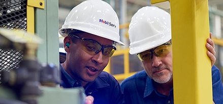 two engineers viewing equipment at plant