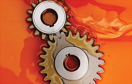 gears in orange oil